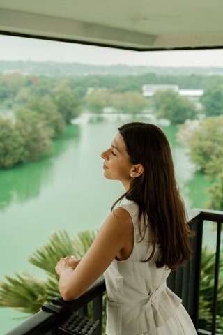 Woman at Balcony of The Nest Hotel Nusa Dua